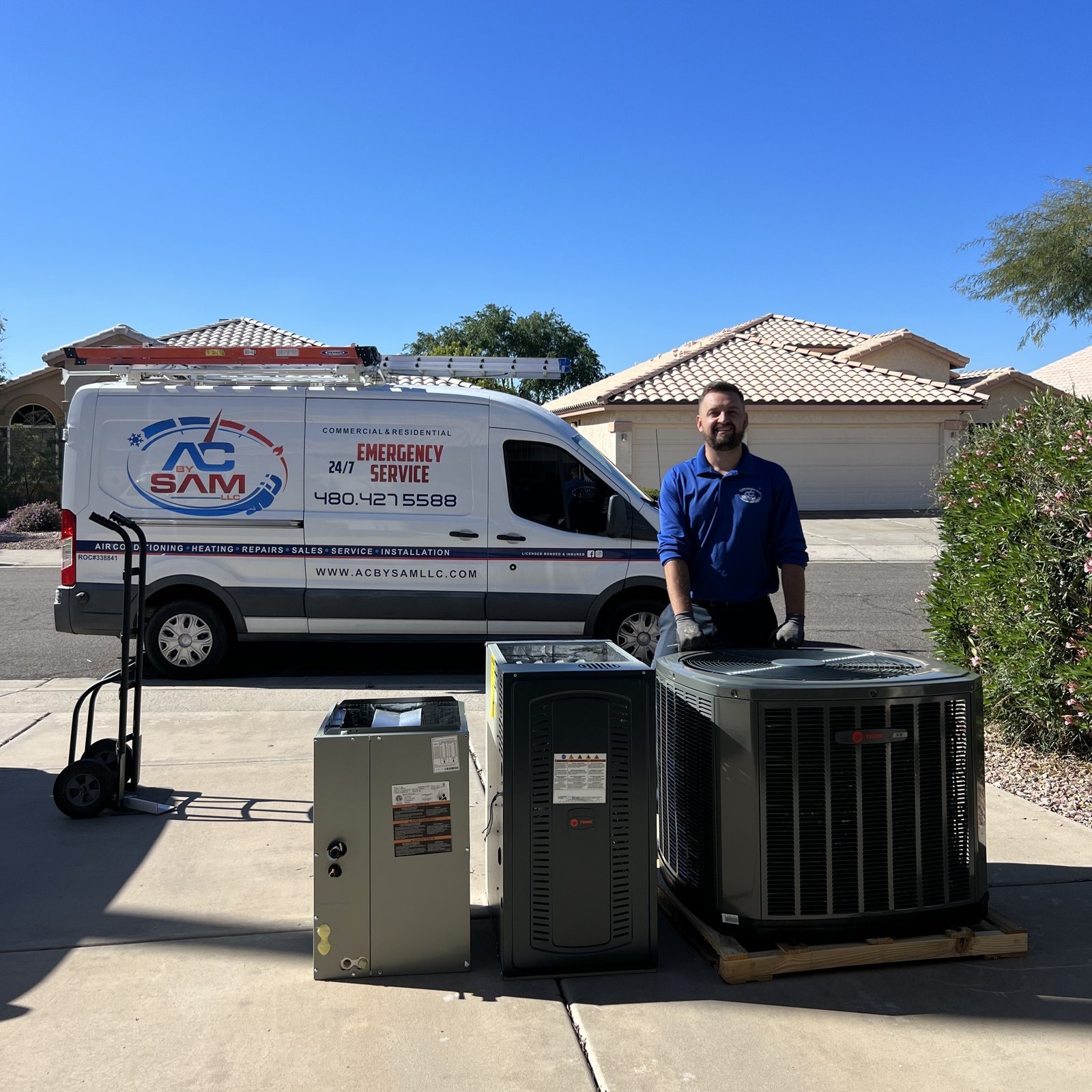 AC by Sam LLC technician installing outdoor HVAC unit in Phoenix home.